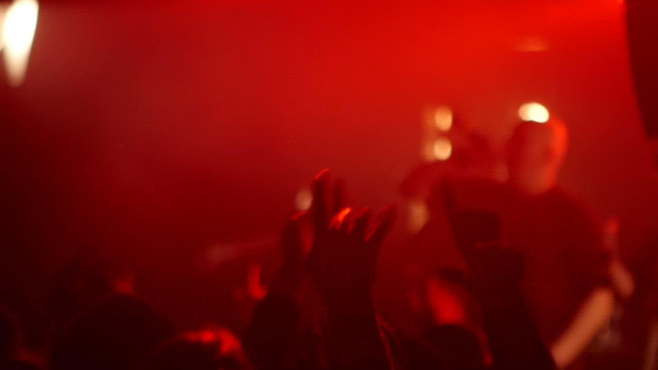 Festival crowd lit in red at night